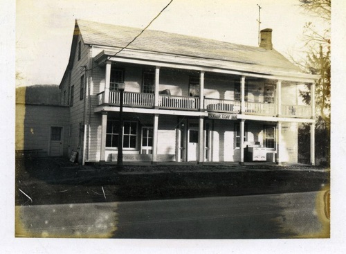 The Sugar Loaf Hotel as it is in 1971 the building seems to have been only half as wide and a story and a half high originally.    When enlarged the upper porch was added, to follow the Canal type of the time. chs-008197